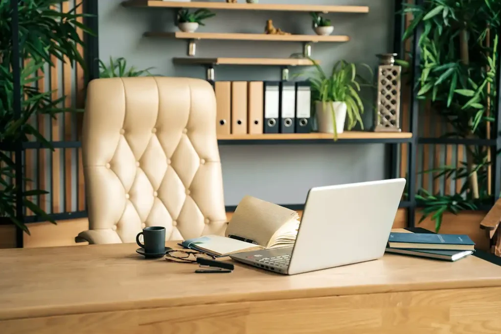 An empty office chair at an executive's desk, representing the founder or business owner